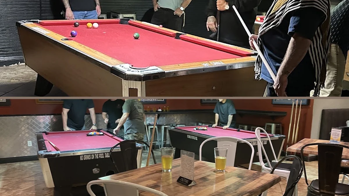 Casual sports bar dining room with TV screens.